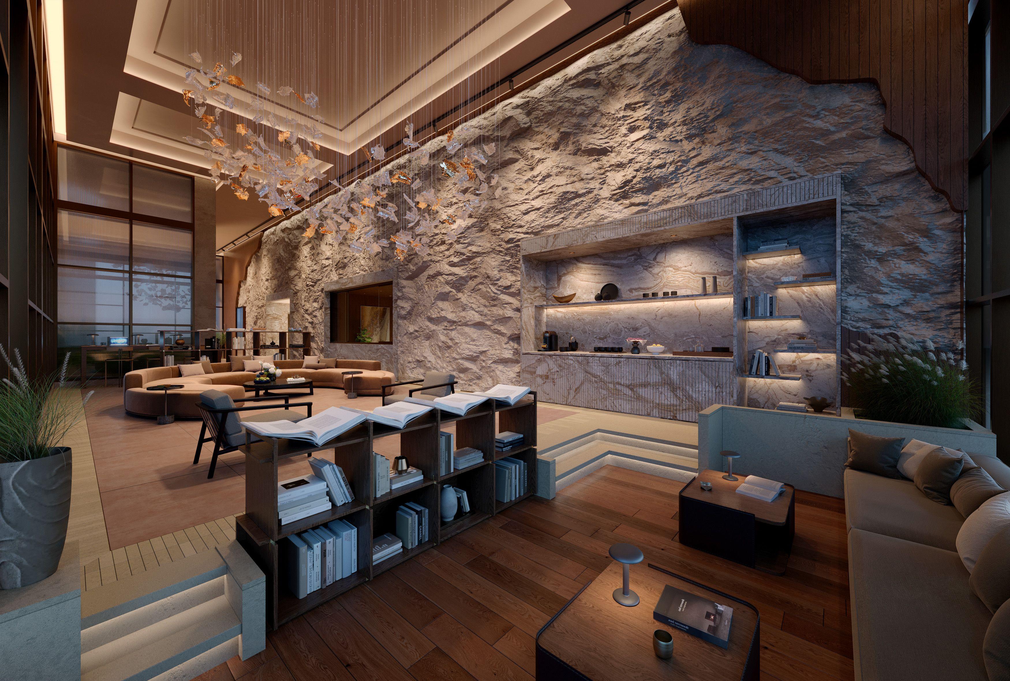 Luxury lobby at Cliff by Aria in Brisbane, featuring a dramatic natural stone feature wall, sculptural lighting installation, and sophisticated lounge seating.